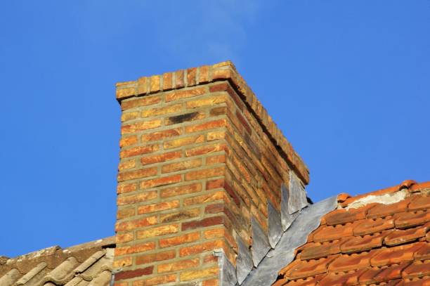 Restored brick chimney on the rooftop.